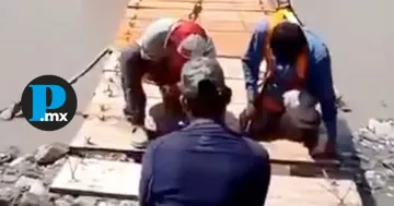 Los vecinos instalaron un puente colgante tras permanecer varios días incomunicados