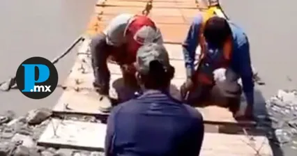 Los vecinos instalaron un puente colgante tras permanecer varios días incomunicados