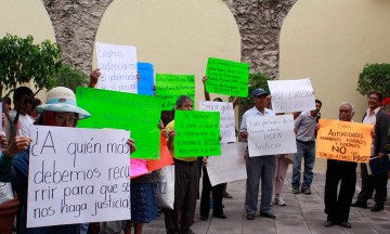 Firman acuerdo para compensar a defraudados