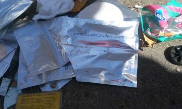 Hallan pruebas de VIH positivo en contenedor de basura