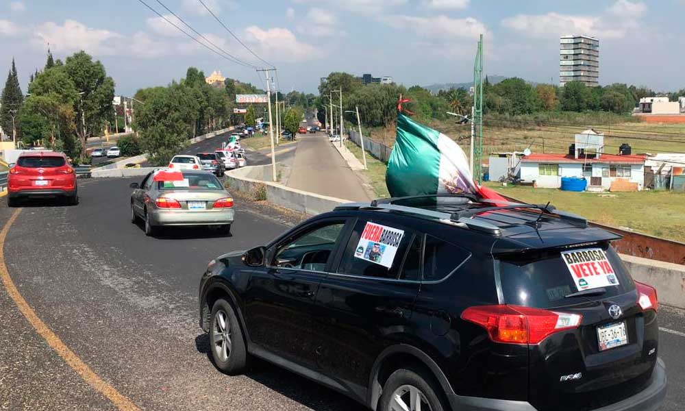 Caravana recibe a AMLO con manifestación en Cholula