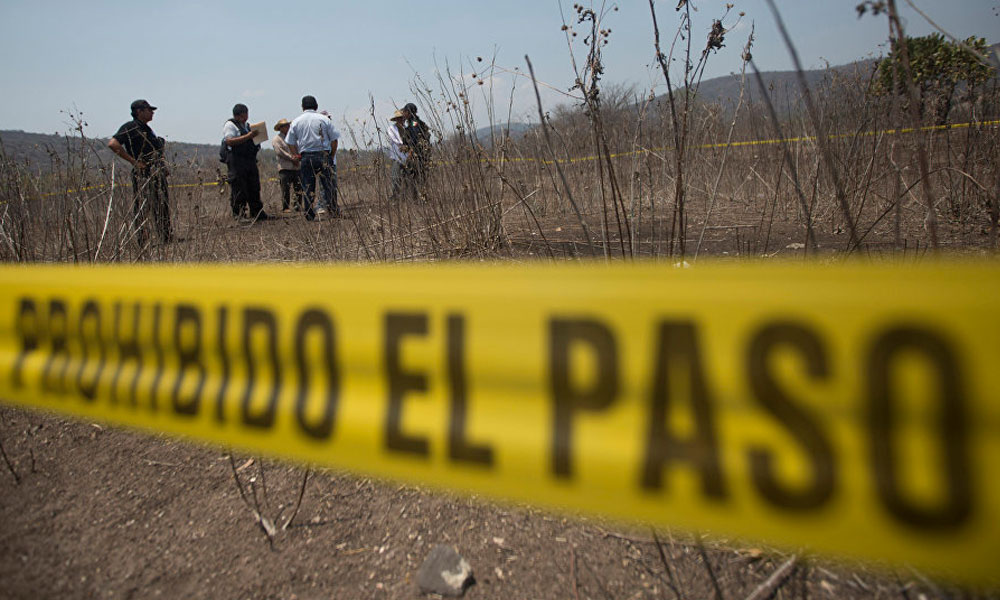 Encuentran cuerpo torturado en terrenos de Coronango