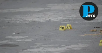 Elementos de la Unidad de Homicidios de la Fiscalía de Puebla realizaron el levantamiento de los cuerpos