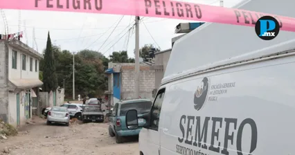 Agentes resguardaron la escena del ataque en San Miguel Canoa tras el hallazgo de dos hechos violentos consecutivos.